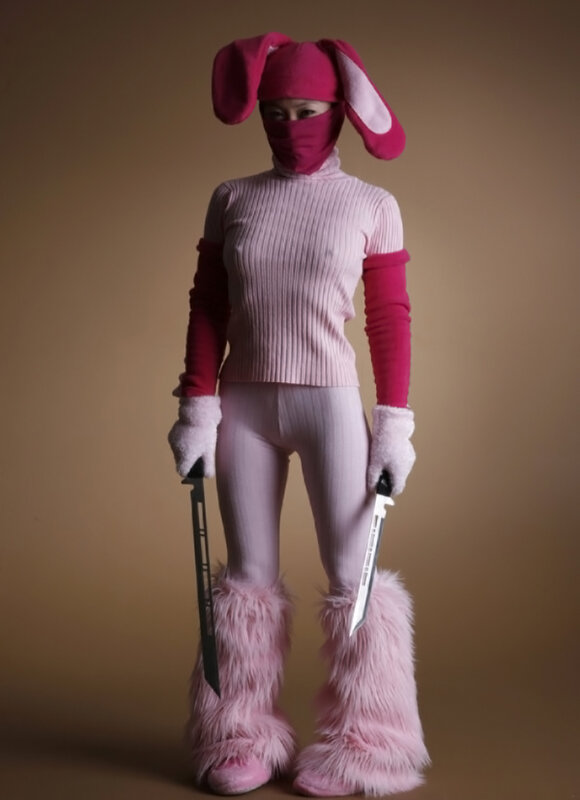 person in pink bunny costume