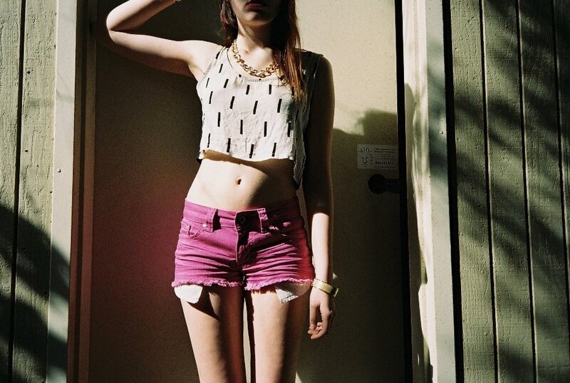 person in pink shorts standing
