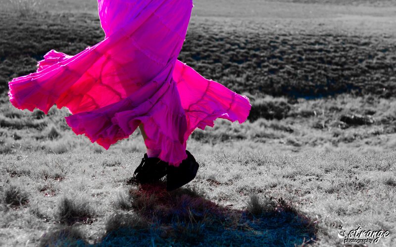 person in pink skirt walking