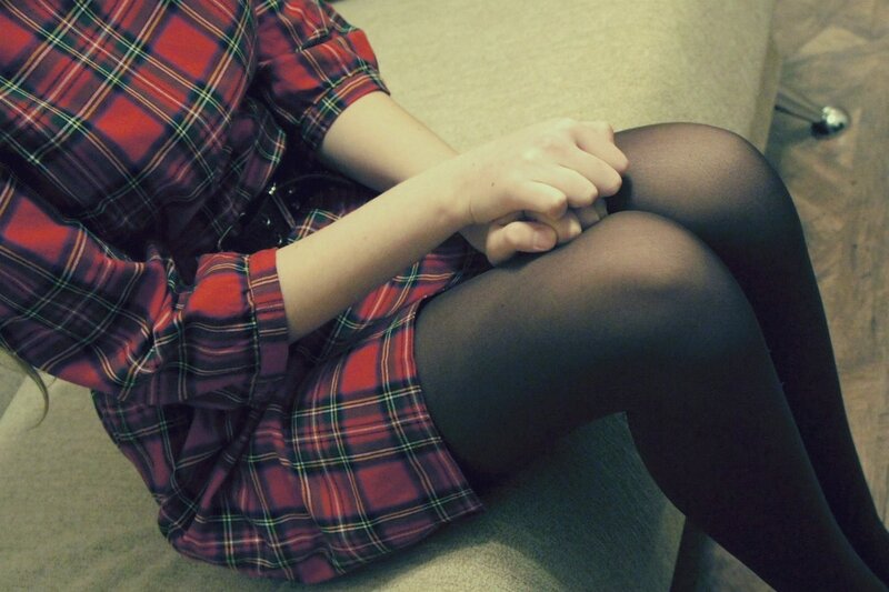 person in plaid dress sitting
