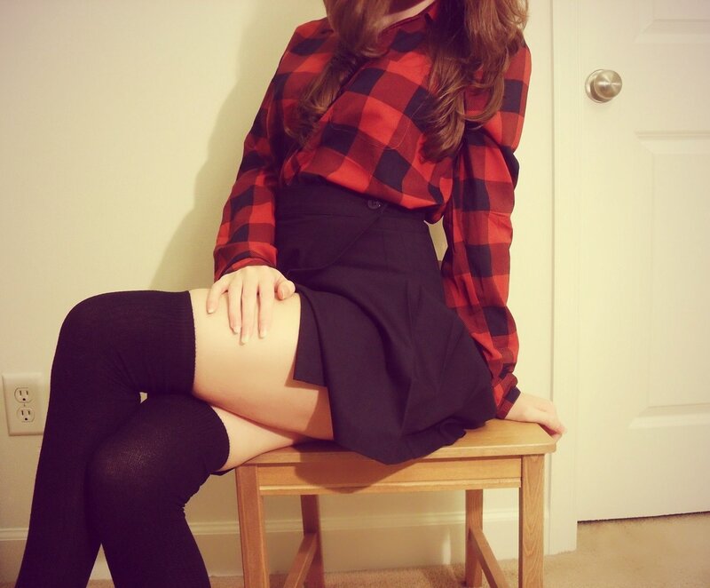 person in plaid shirt sitting