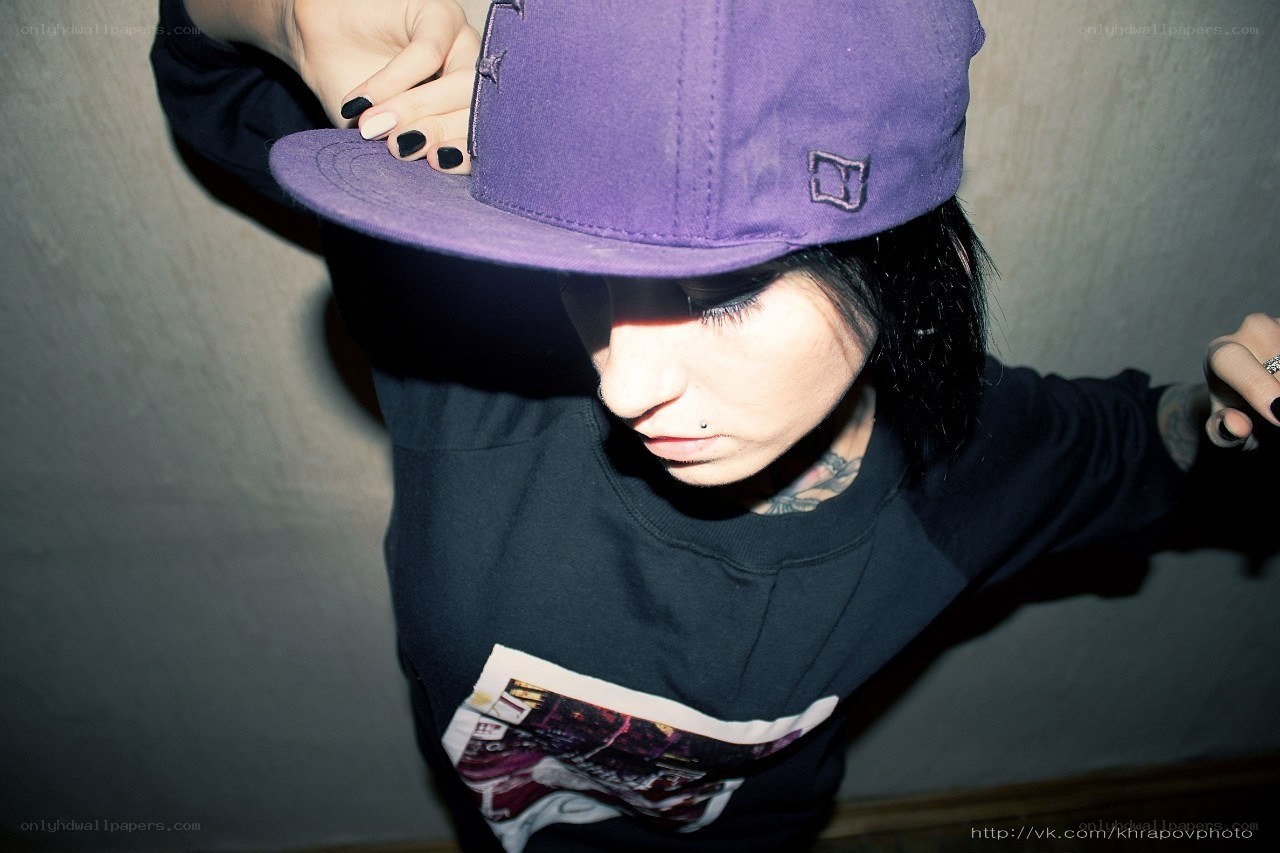 person in purple cap