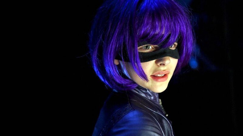 person in purple wig and mask