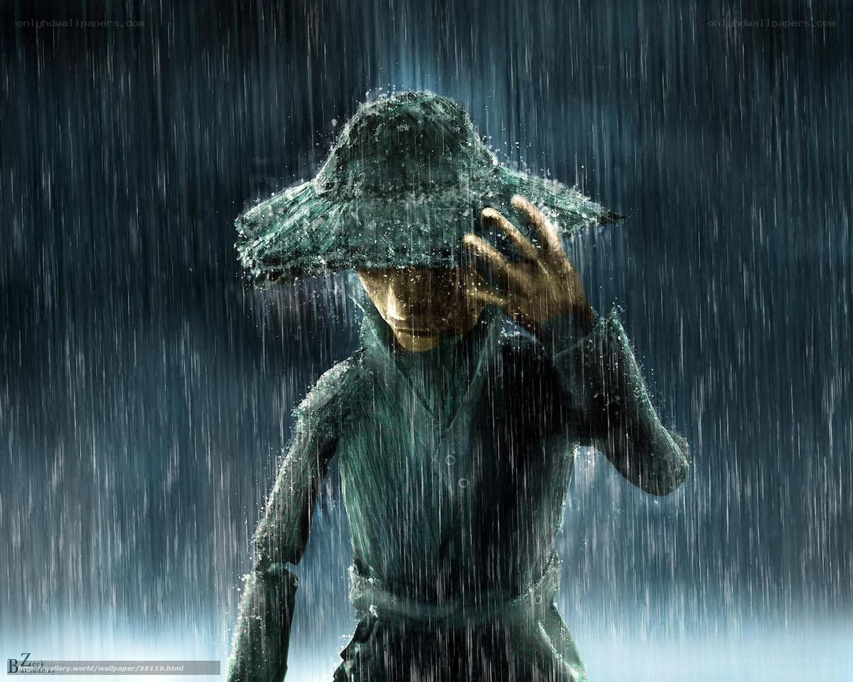 person in rain with hat