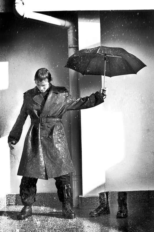 person in rain with umbrella