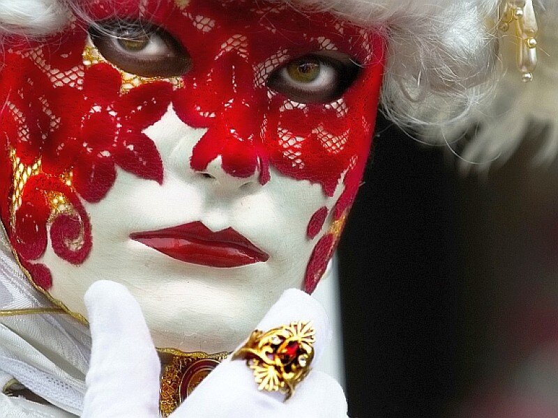 person in red and white mask