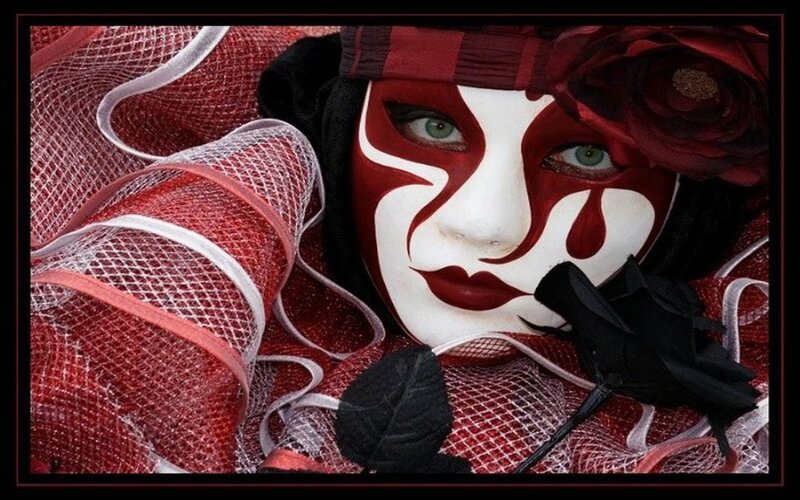Person in Red and White Mask — Dramatic