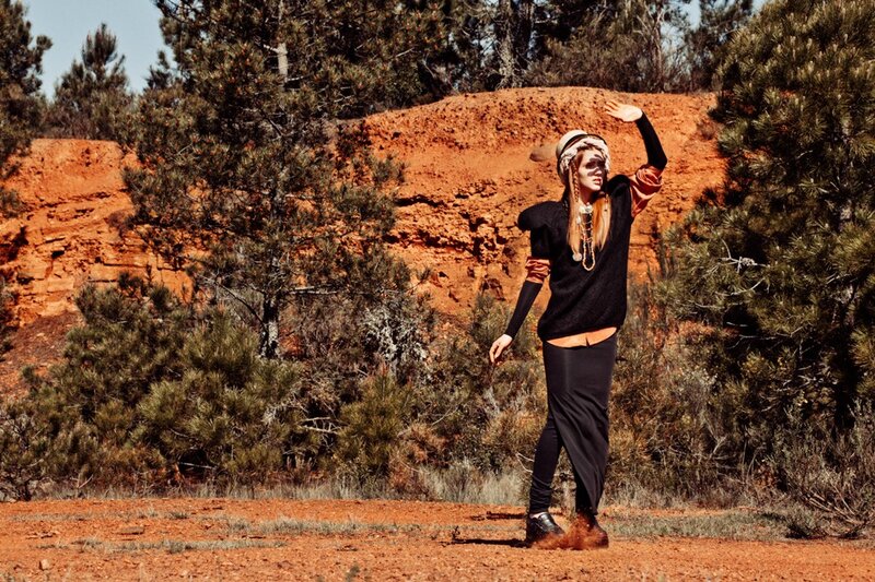 person in red dirt landscape