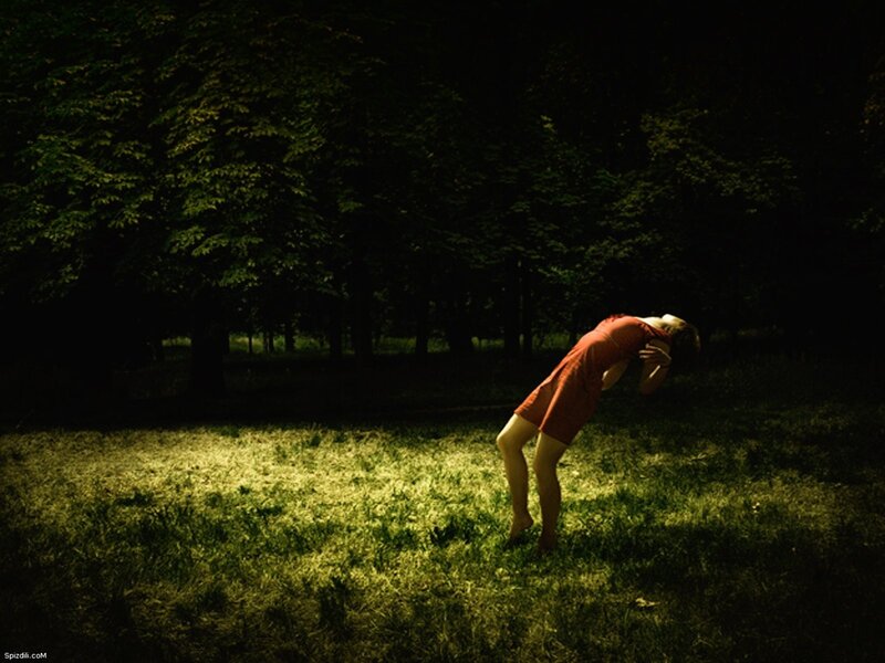Person in red dress bending