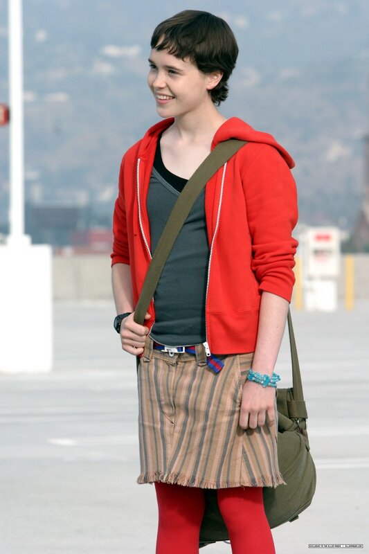 person in red hoodie smiling