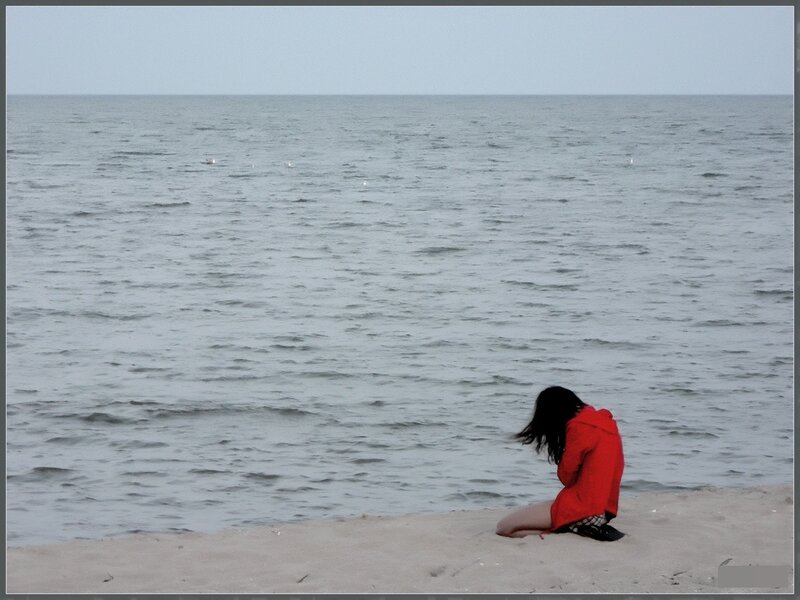 Person in Red Jacket — Solitary
