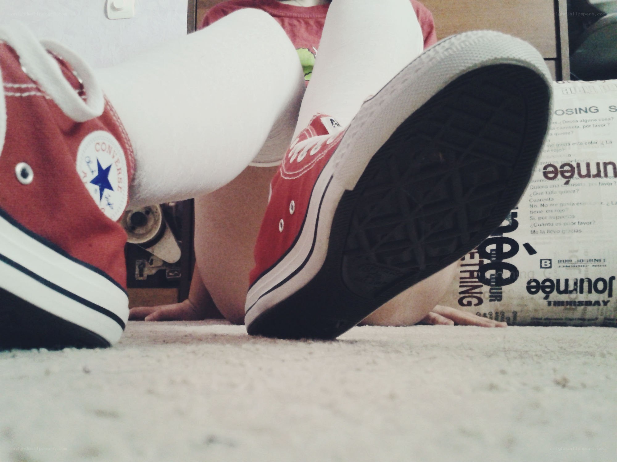 person in red sneakers