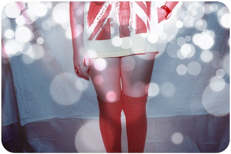 person in red socks and skirt