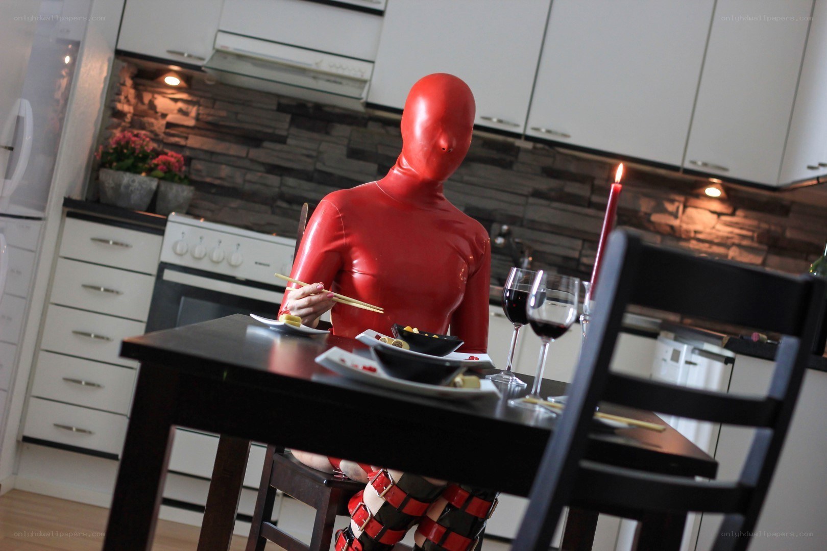 person in red suit eating dinner