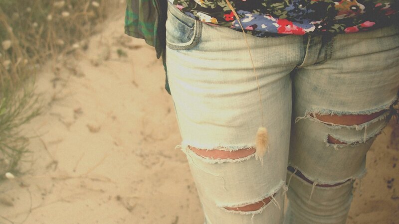 person in ripped jeans