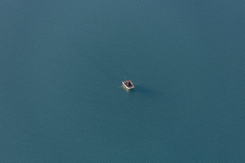 Person in Rowboat — Blue, Serene, Afternoon