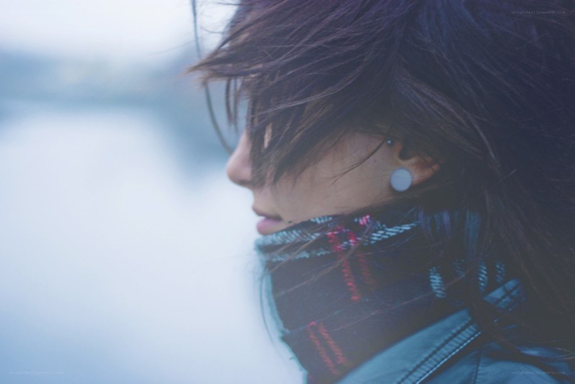 person in scarf looking away