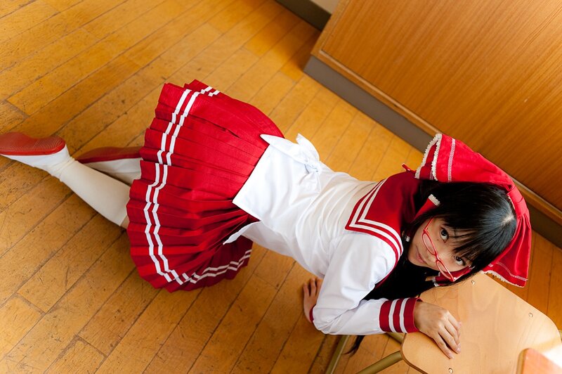 Person in School Uniform — Red, Playful, Photograph, School Desk, Wooden Floor