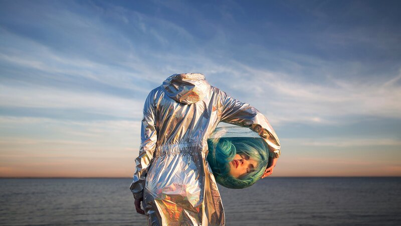 Person in Silver Suit