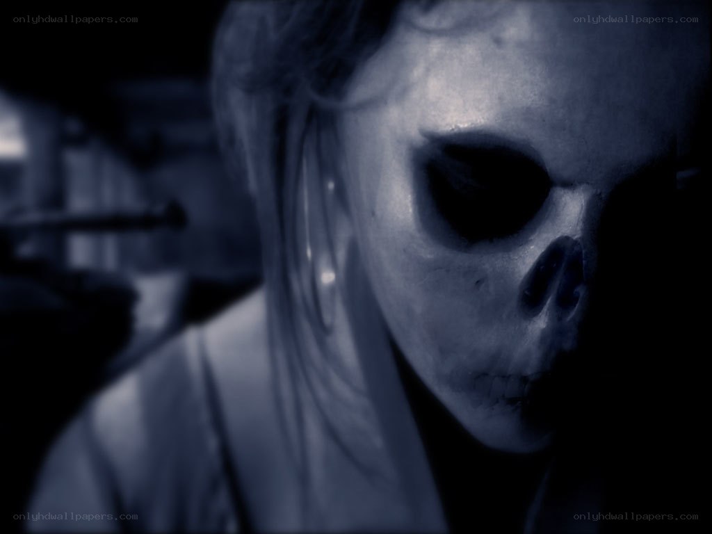 person in skull mask