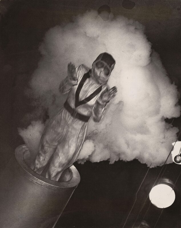 person in smoke emerging from pipe