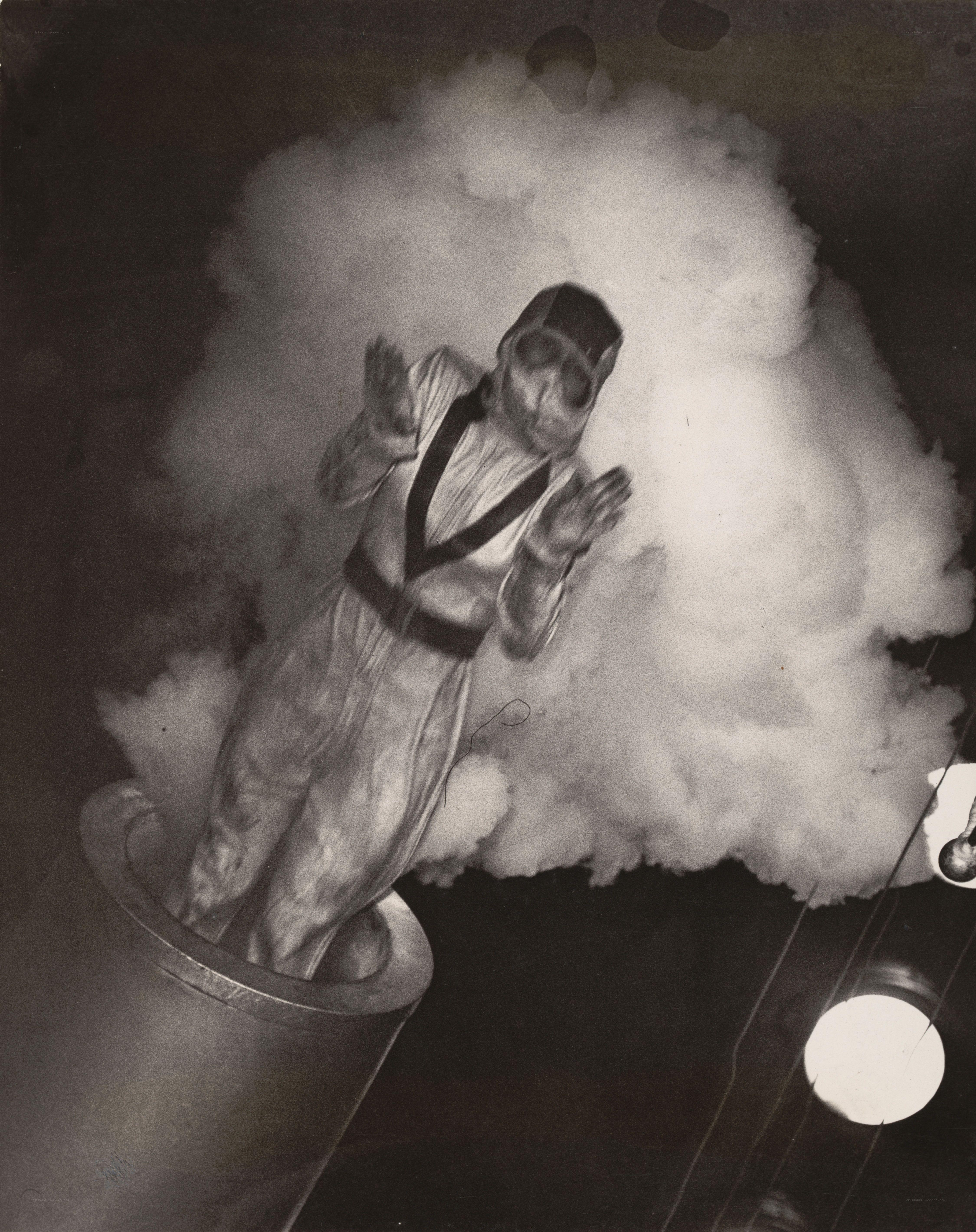 person in smoke emerging from pipe