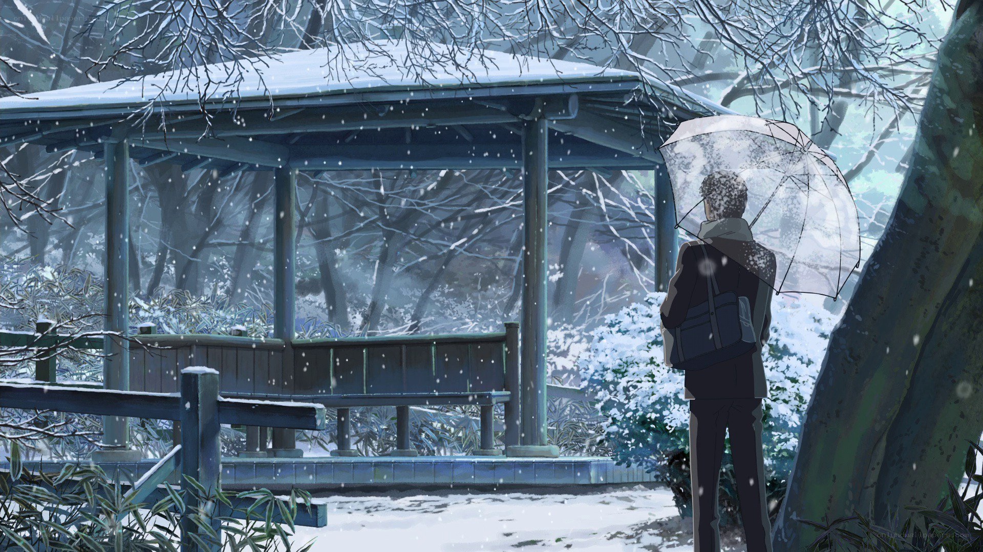 person in snow with umbrella