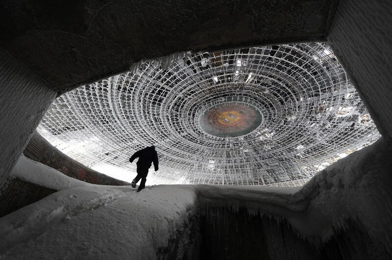 Person in snowy dome structure