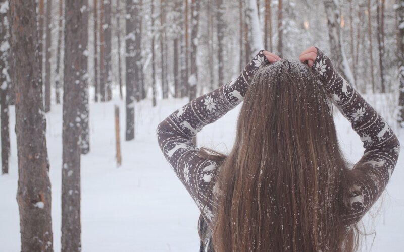 person in snowy forest