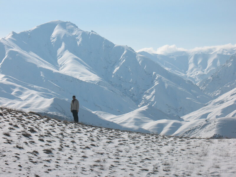 Person in snowy mountain landscape
