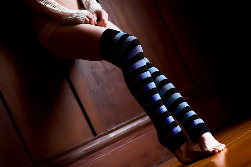 person in striped leg warmers