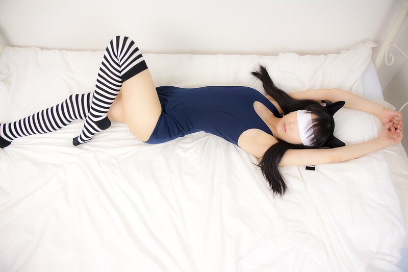 person in striped socks on bed