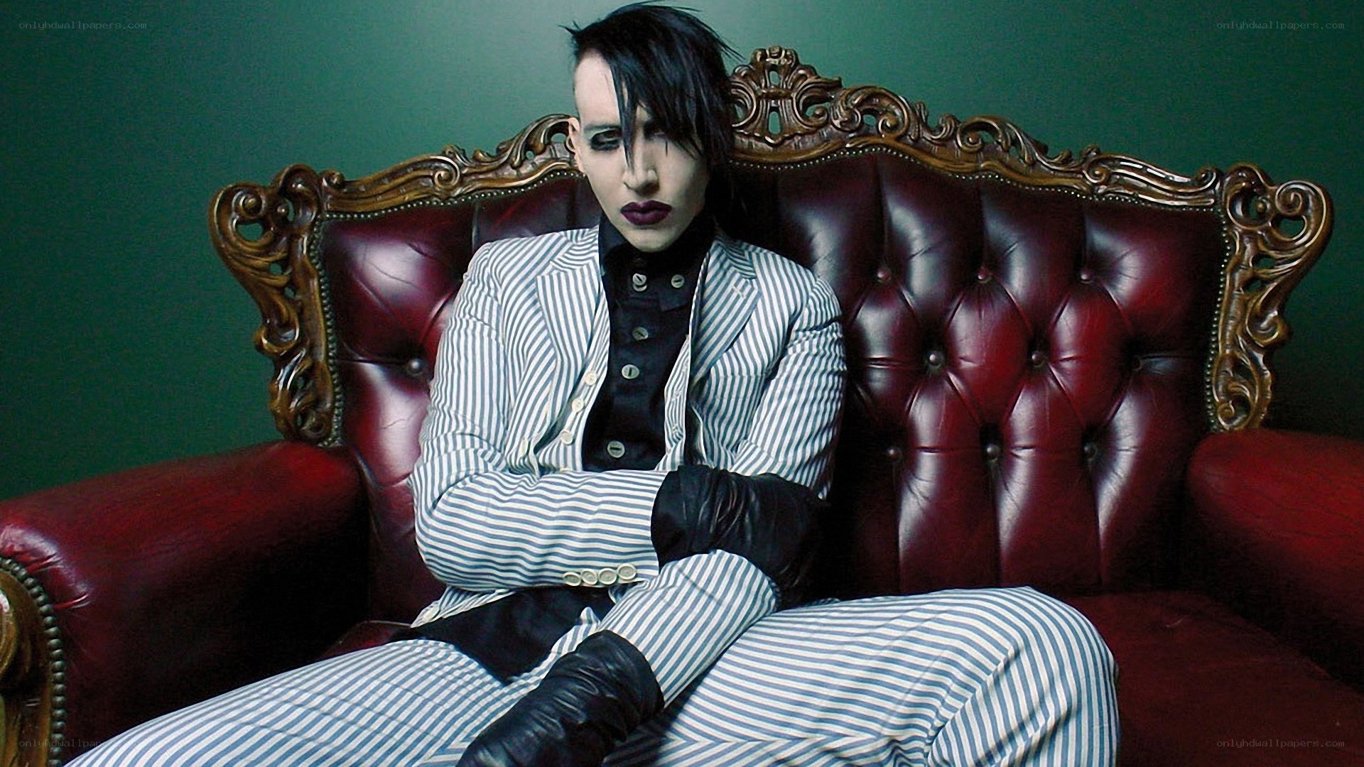 person in striped suit on couch