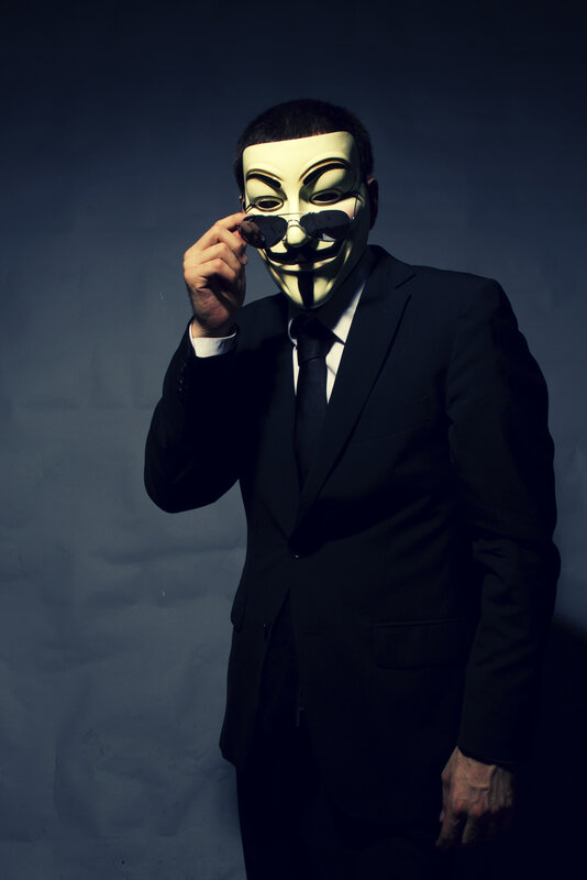 person in suit with mask