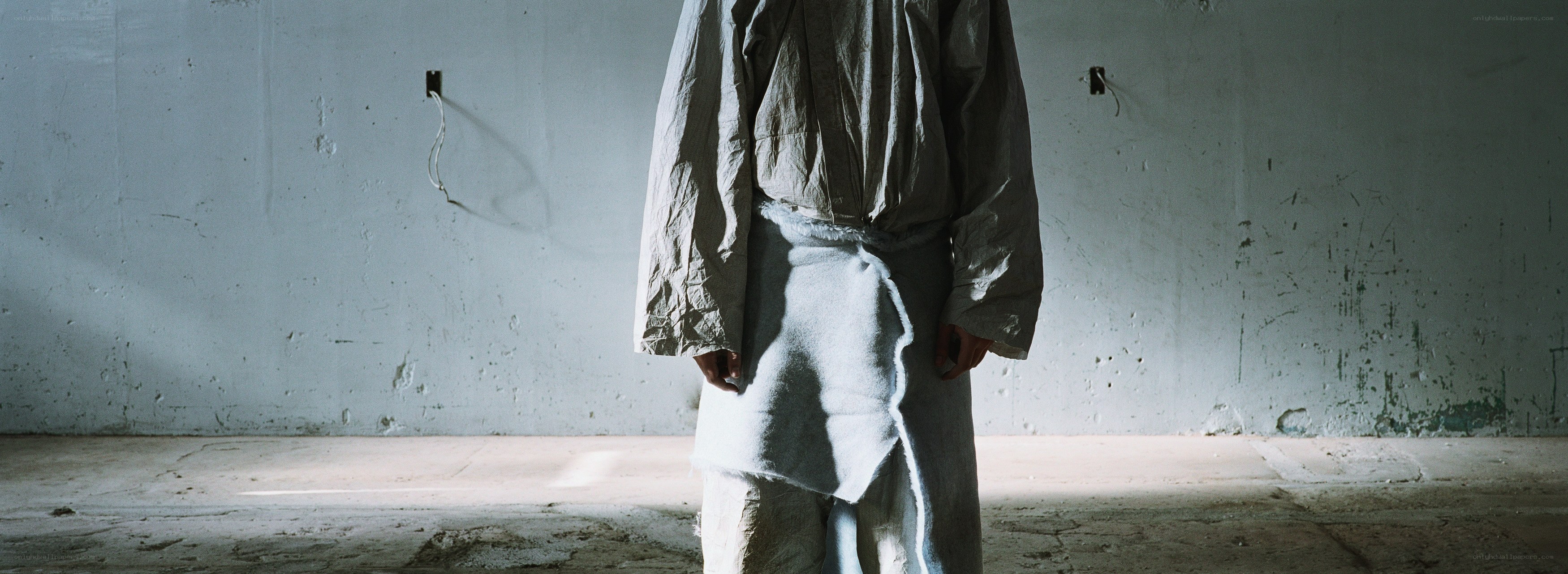 person in tattered clothes