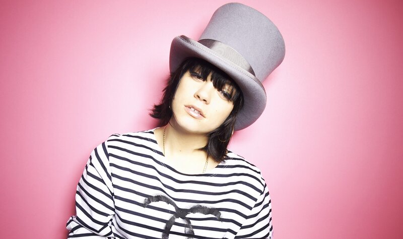 person in top hat and striped shirt