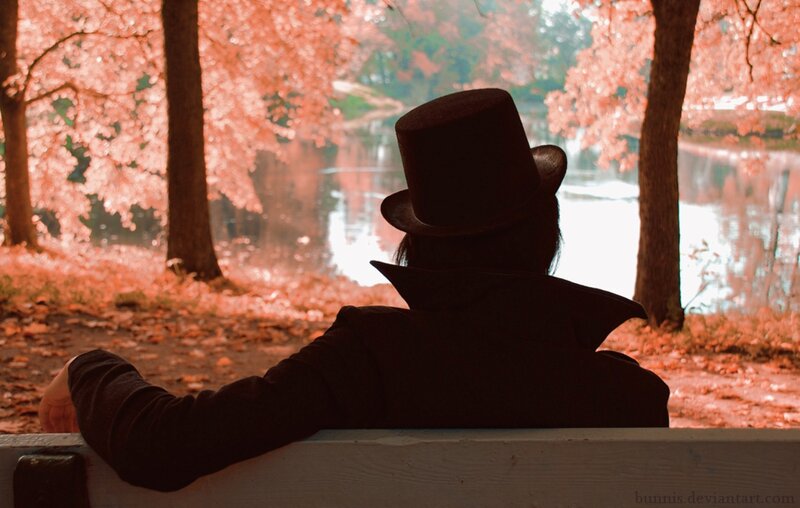 Person in Top Hat on Bench