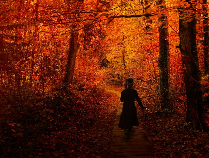 Person in Top Hat Walking — Orange