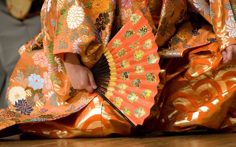person in traditional orange kimono