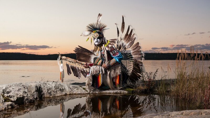 Person in Traditional Regalia — Brown, Serene