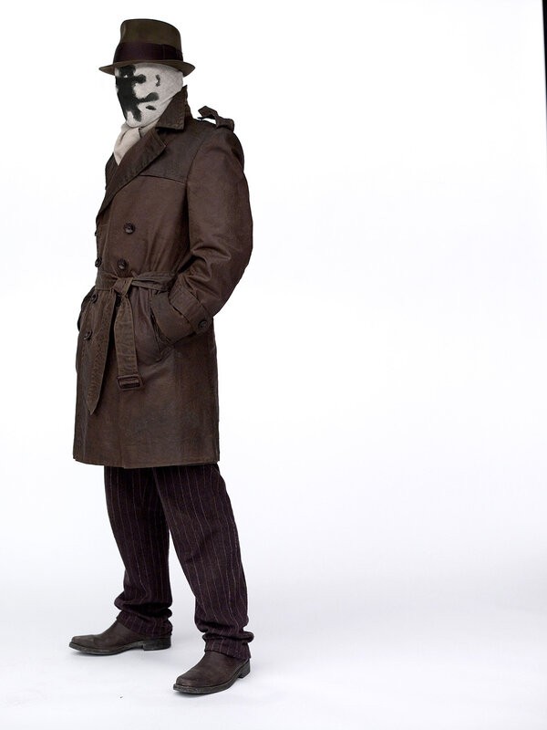 person in trench coat and mask