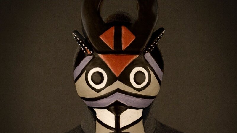 person in tribal mask