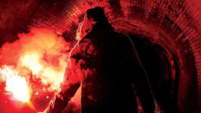 person in tunnel with flare