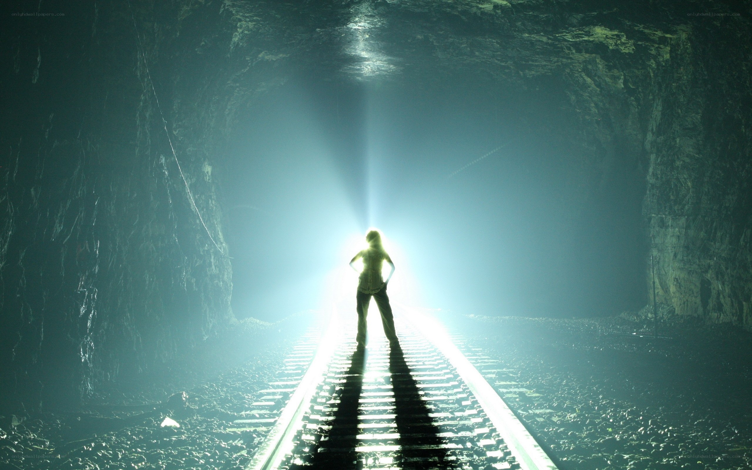 person in tunnel with light