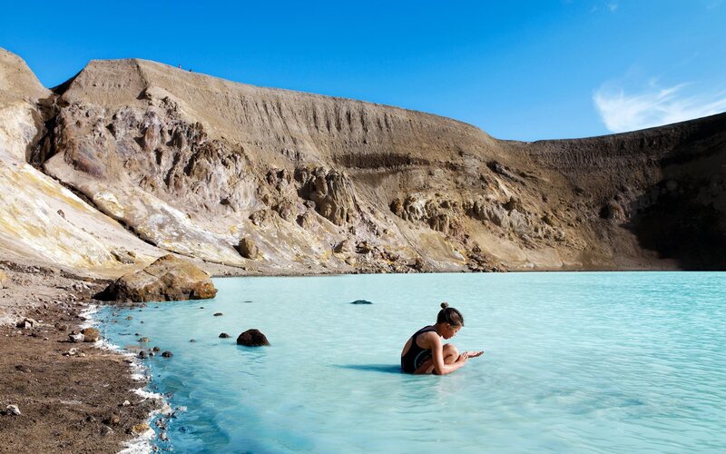 Person in turquoise lake