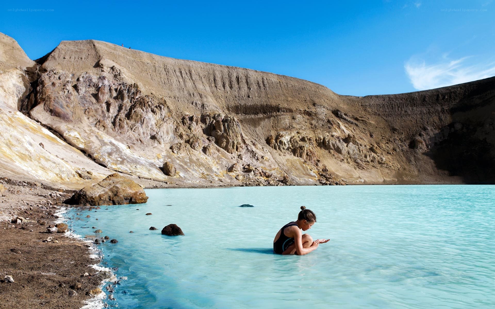 Person in turquoise lake