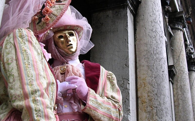 person in venetian carnival costume