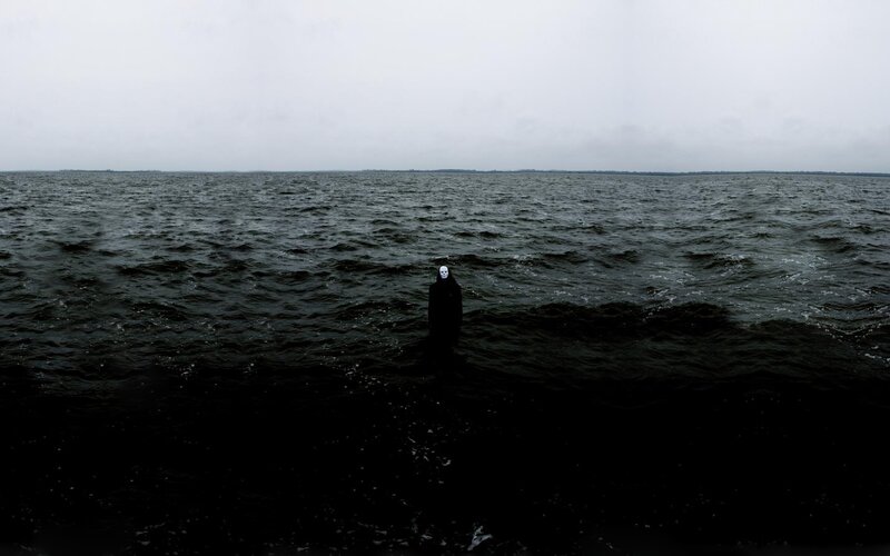person in water wearing mask
