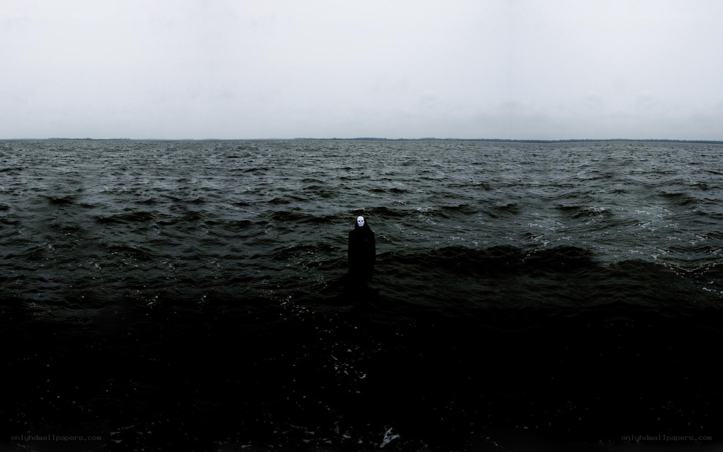person in water wearing mask