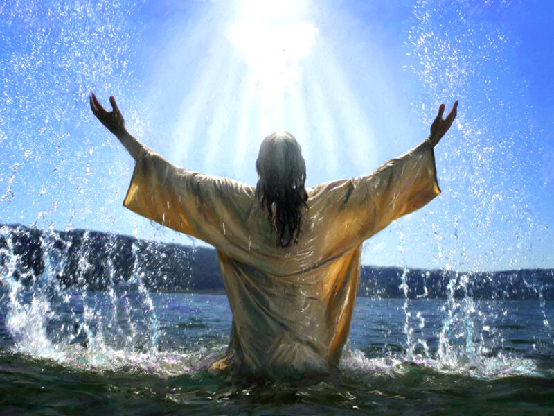 Person in Water with Arms Raised